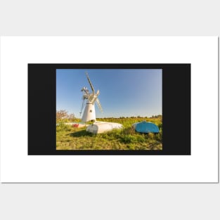 Day boats upside down on the riverbank with Thurne Mill in the background Posters and Art